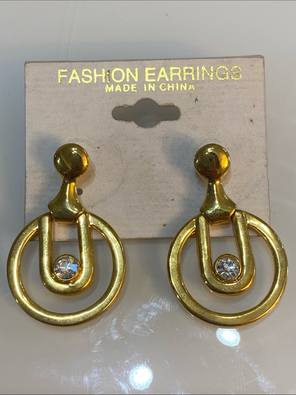 Gold tone pierced earrings